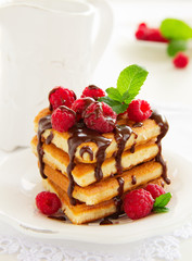 Waffles with raspberry, honey and chocolate.