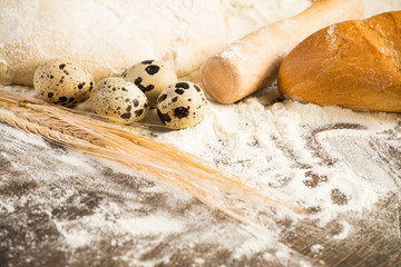 Obraz na płótnie Canvas flour, eggs, white bread, wheat ears