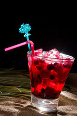 Raspberry cocktail on the sand