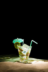Kiwi cocktail on the sand