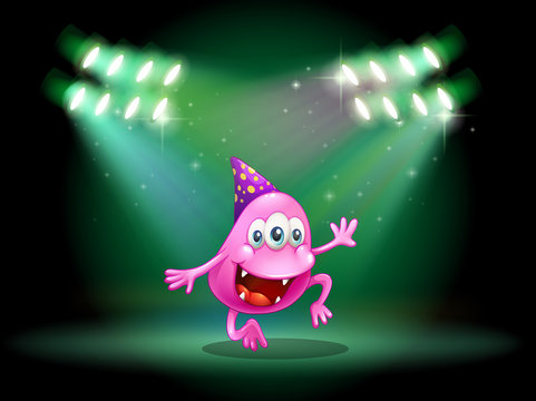 A monster dancing in the middle of the stage