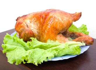 Chicken grilled on a plate with fresh salad
