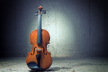 Violin on concrete wall