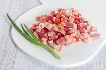 Sliced  bacon on a cutting board