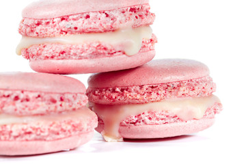 Pink French macarons isolated on white background