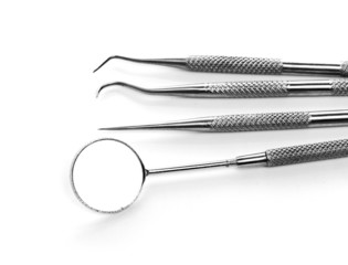 Basic dentist tools isolated on white