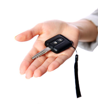 Closeup portrait of a female hand holding car keys