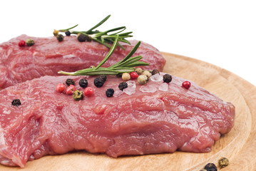 raw meat with rosemary