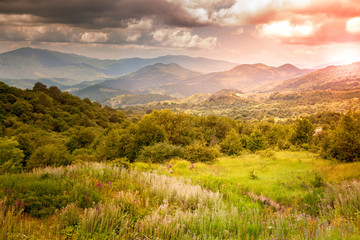 majestic bright sunset in the mountains © olezzo