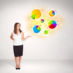 Business woman with colorful graphs and charts