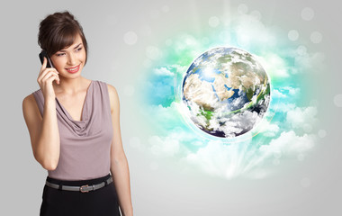 Young woman with earth and cloud concept