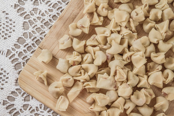 Homemade Raw Ravioli on a Cutting Board