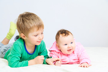 portrait of little boy with newborn sister