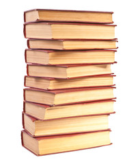 stack of old books with yellowed pages on white background