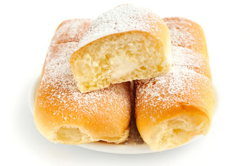 Italian buns with sweet cream on white background