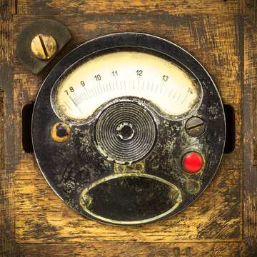 Vintage industrial meter in a wooden box