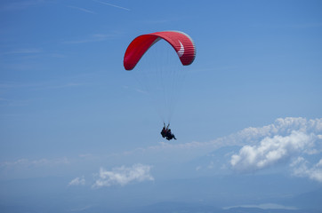 Paraglider over Austrian Alps with Krawanken Range on background
