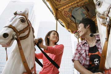 couple going on merry-go-round