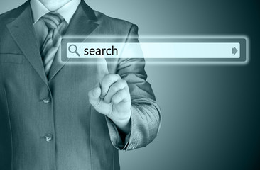 Businessman pushing virtual search bar