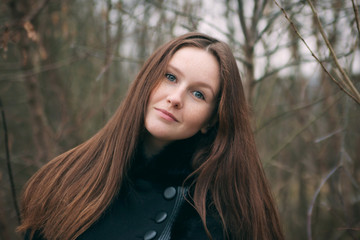 Portrait of a beautiful model with freckles on her face. Outdoor