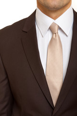 brown suit with tie