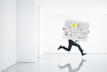 businessman running fast with business strategy in his hands