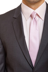 grey suit with pink tie
