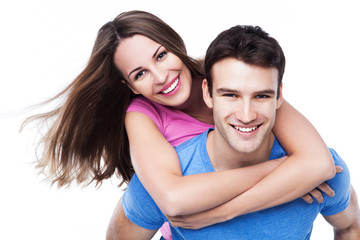 Man giving woman piggyback ride