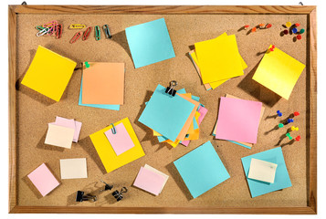 Editable blank post-its and office supplies on message board.