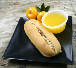 bread with cream coffee and orange juice