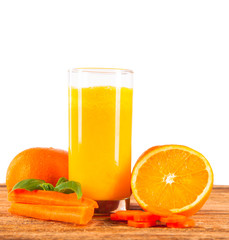 Fresh orange juice and fruits on wood plant