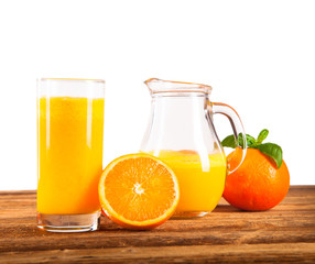 Fresh orange and carrot juice on wood 