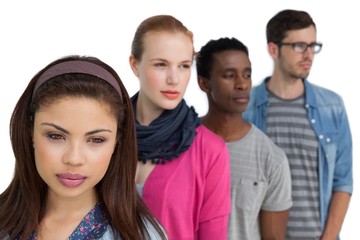 Portrait of four serious young friends