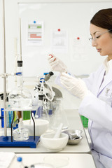 female researcher conducting experiment