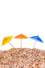 Cocktail Umbrella in Sand Mound with Shells