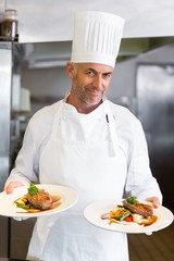 Confident male chef with cooked food in kitchen