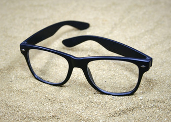 Sunglasses on sand