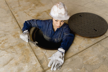 woman working in manhole