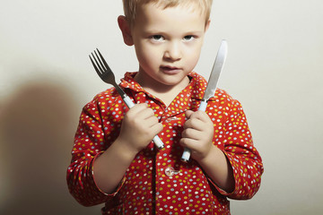 Little Handsome Boy with Fork and Knife.Hungry Child.Food