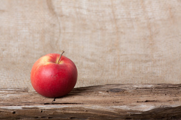 Apple on wooden board