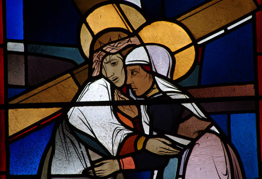 Jesus carrying the cross meets his mother Mary. Stained glass