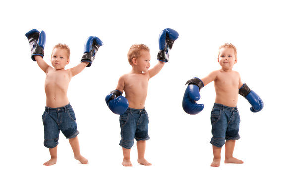 Young Kid With Boxing Gloves In Winning Poses