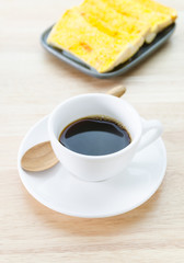 Cup of coffee and garlic bread