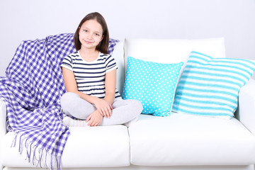 Fototapeta premium Beautiful little girl sitting