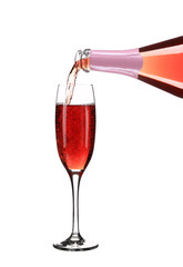 Pink champagne pouring in a glass.