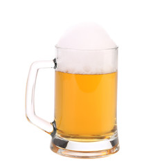 Mug of fresh beer with foam.