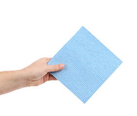 Hand holds blue cleaning sponge.