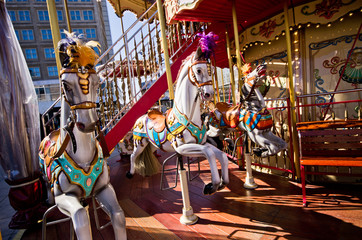 Fototapeta na wymiar Old-style carousel with ponies