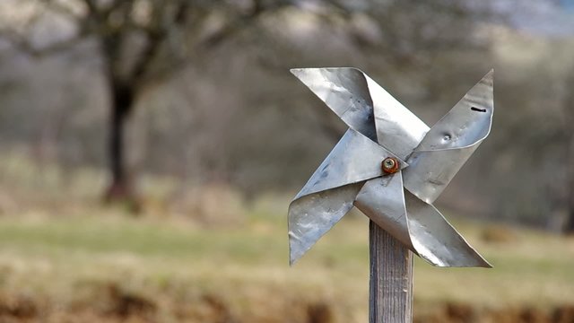 Homemade pinwheel of sheet metal is ugly and dysfunctional