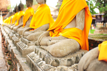 Row of Stone Buddha Statue in Ayutthaya Province, Thailand - obrazy, fototapety, plakaty